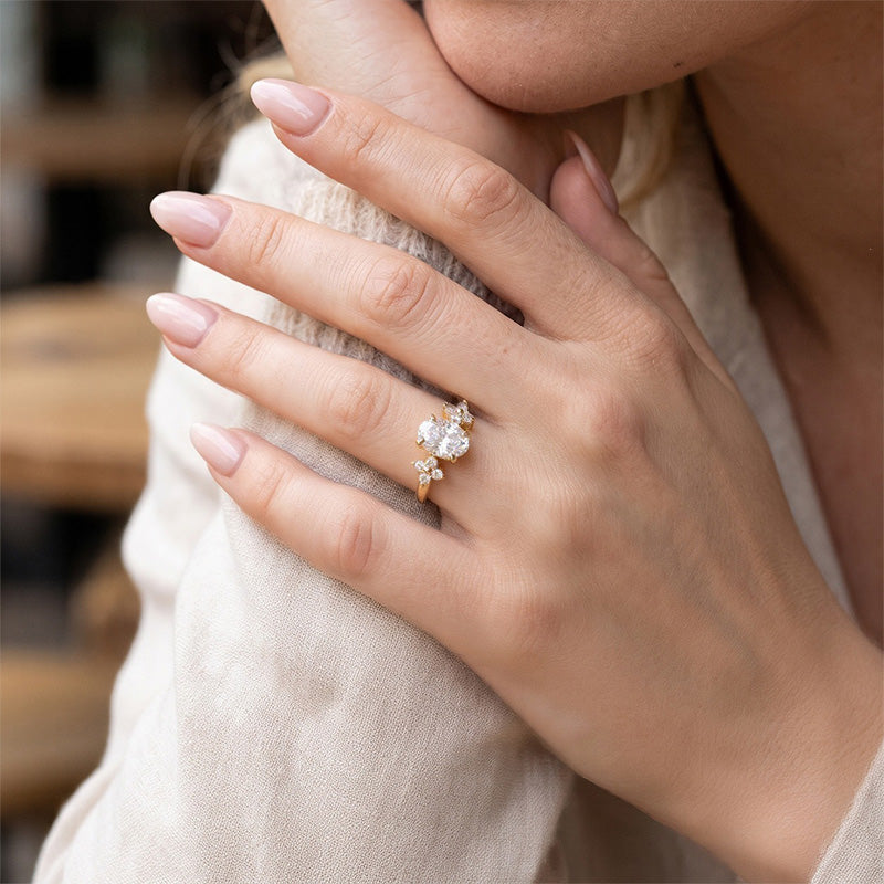 Oval Four-Prong Flower Accent Moissanite Ring