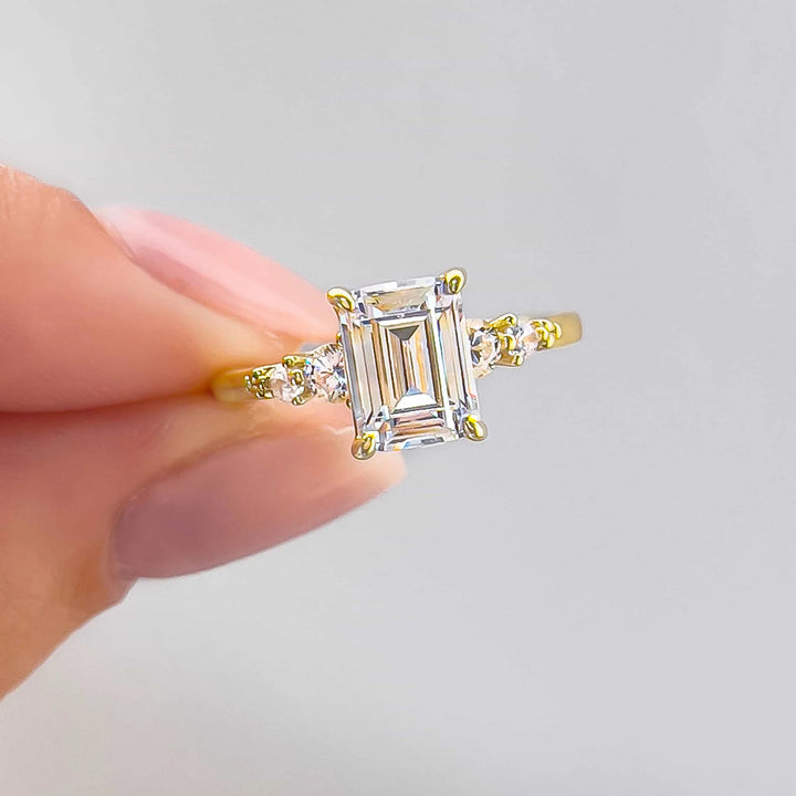 Emerald Cut Side Round Accent Ring