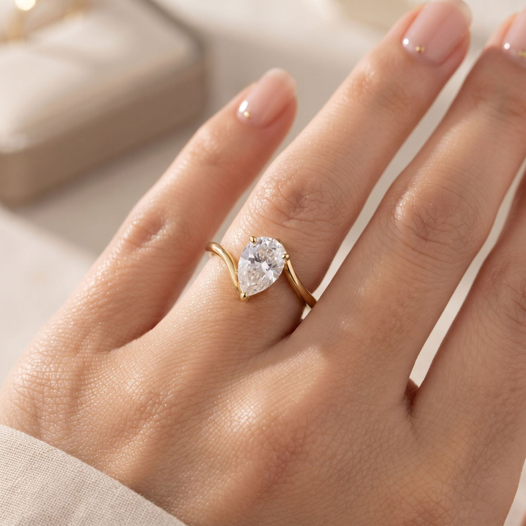 Pear Cut Twist Solitaire Moissanite Ring