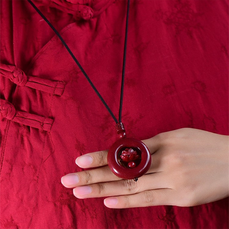 Cinnabar Hollow‑Carved Lotus Peace Donut Pendant Necklace