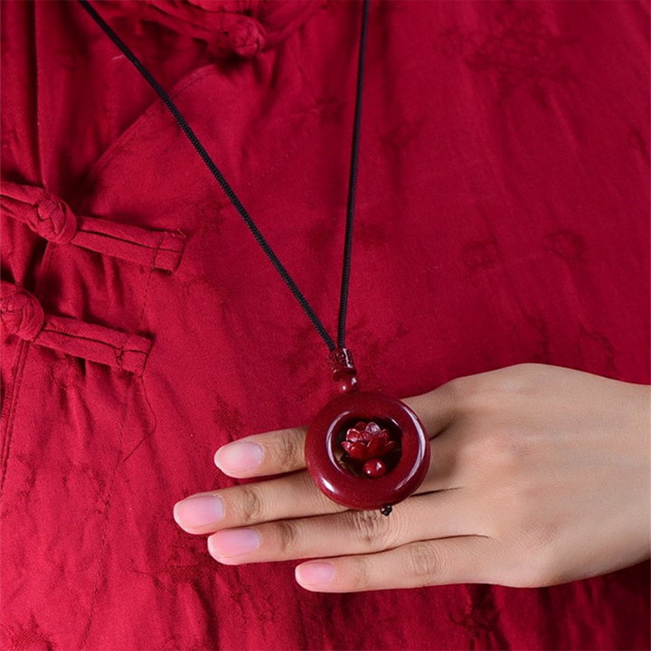 Cinnabar Hollow‑Carved Lotus Peace Donut Pendant Necklace