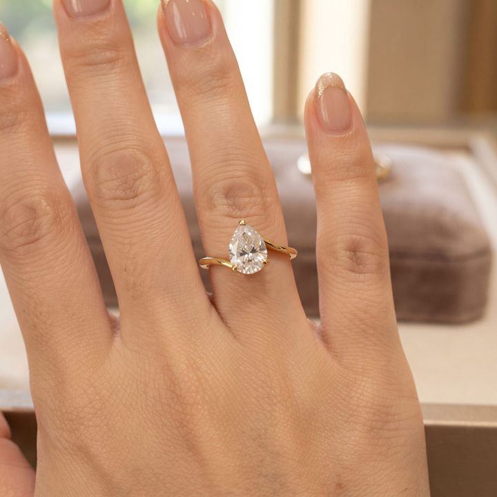 Pear Cut Twist Solitaire Moissanite Ring