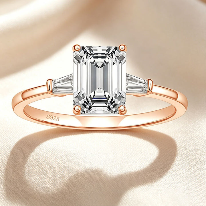 Emerald-cut three-stone ring