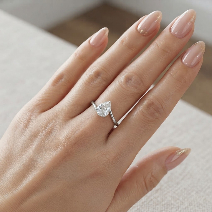 Pear Cut Twist Solitaire Moissanite Ring